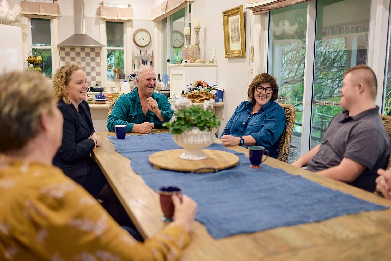 People sitting around a table and smiling