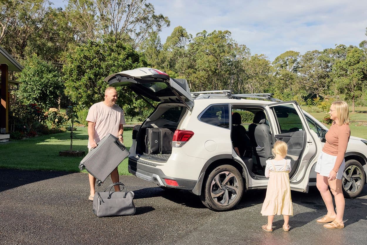 Car loan vs Personal loan - family getting ready to go on a road trip.