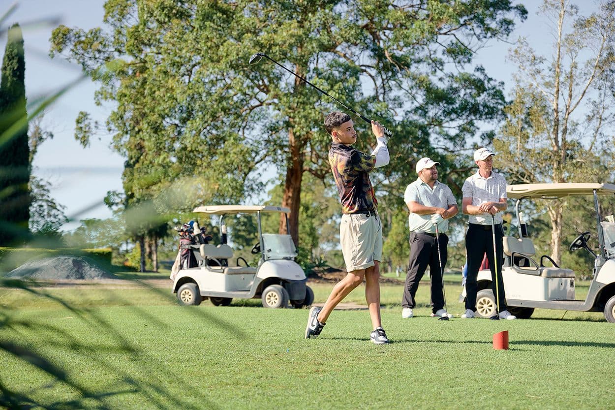 Men playing golf