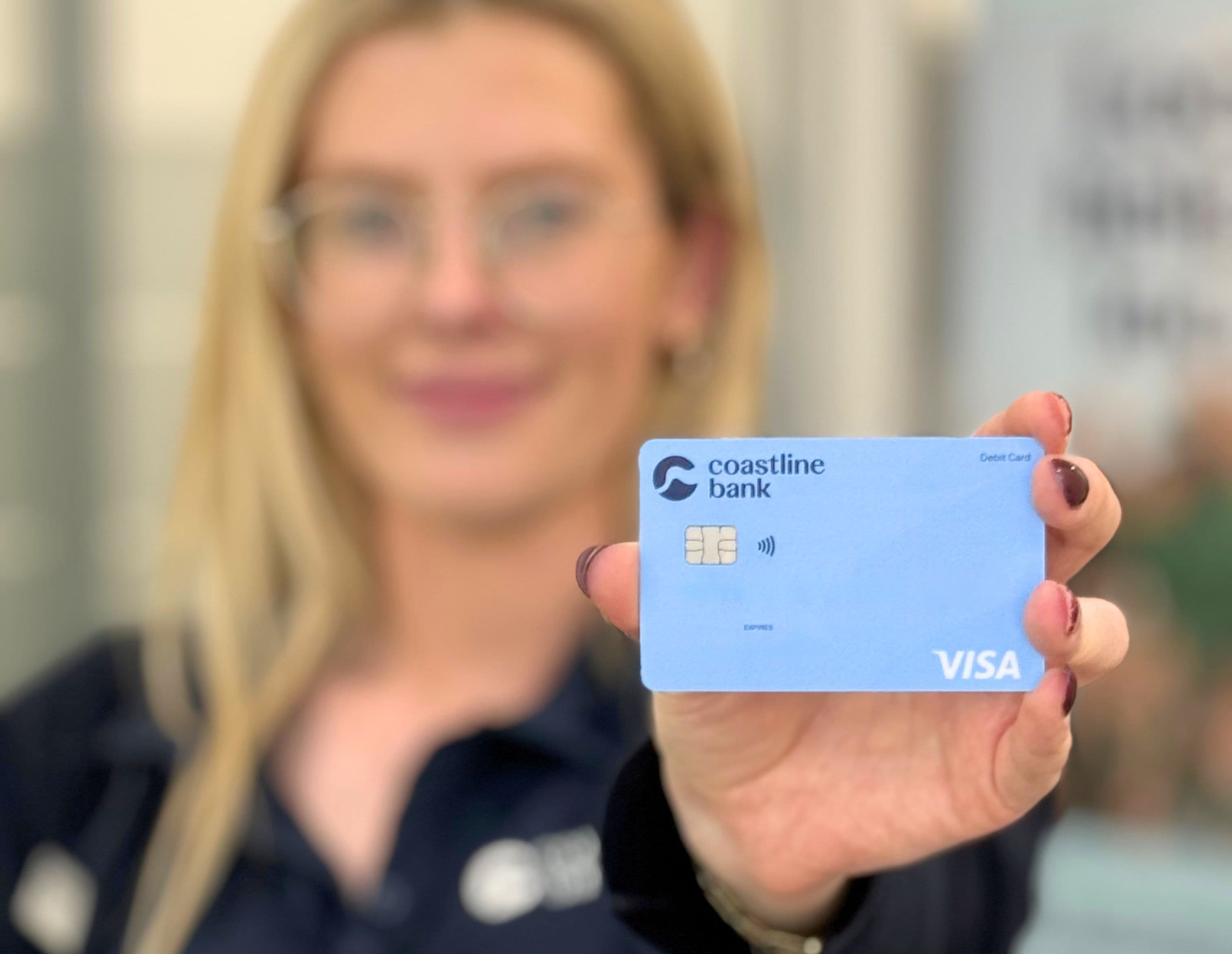Woman holding a Visa card