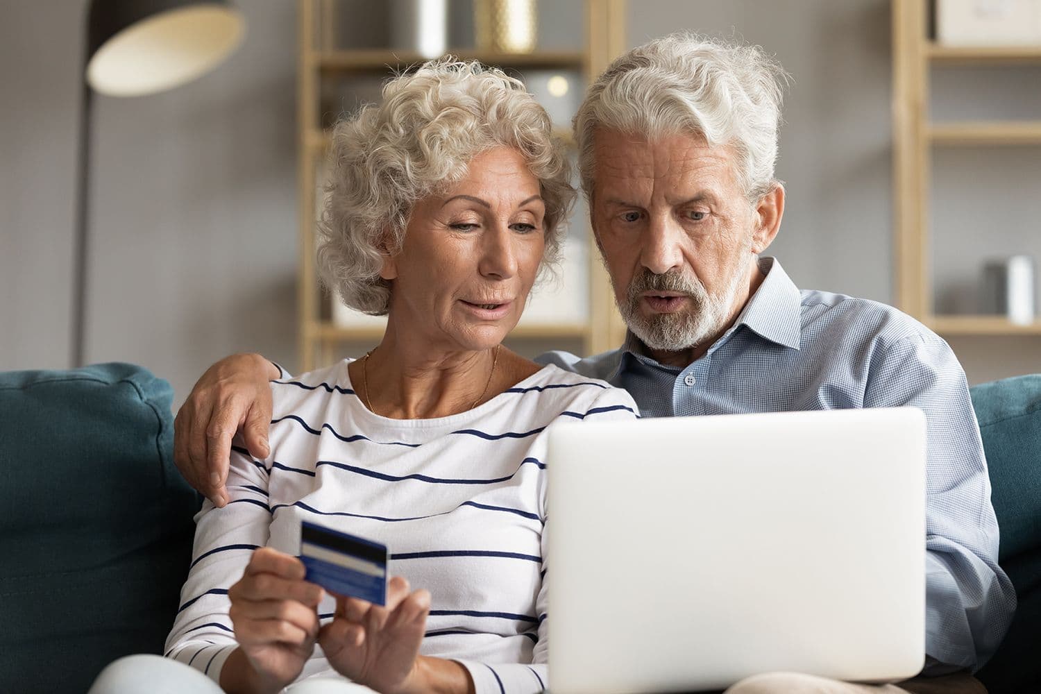 Elderly couple trying to buy a product online